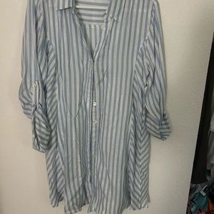 Long sleeve light blue, white and metallic button down blouse with button cuffs